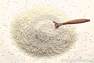 The arborio rice in wooden spoon Stock Photo