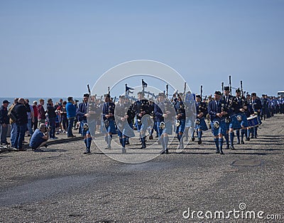 Arbroath, Scotland-4th June 2016:People watching a Pipe Band marching at the Festival For Hero`s public event, held at Arbroath. Editorial Stock Photo