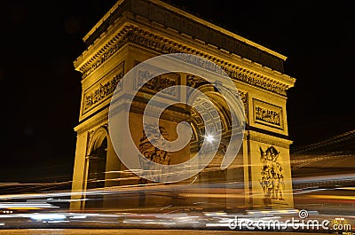 Arc de Triomphe in Paris, France - night view with traces of cars lights Stock Photo