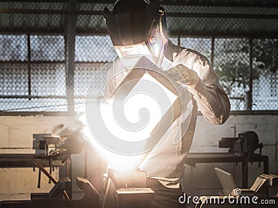 Working welder in action with bright sparks. Stock Photo