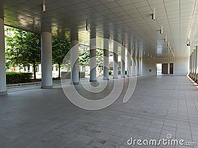 The arcade full of columns in Perspective in a modern building in Bologna fair district Italy Stock Photo