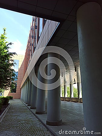 The arcade full of columns in Perspective in a modern building in Bologna fair district Italy Stock Photo
