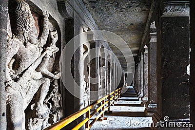 Arcade with reliefs of Hindu Gods inside of the Kailasa temple, Ellora caves, Maharashtra, India Stock Photo