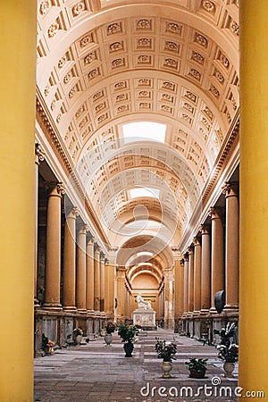 BOLOGNA - ITALY, APRIL 16, 2017. Arcade with tombs and monument inside the Monumental Cemetery of Certosa di Bologna Editorial Stock Photo