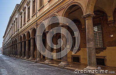 The arcades of Via Zamboni, University Area, in old Bologna city center. Italy Editorial Stock Photo