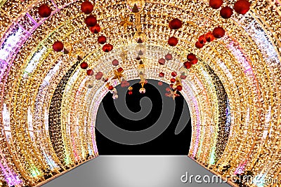 Arch bokeh gold, Blurred arch Bokeh golden light background night arch of lamps LED colorful yellow shine, Backdrop arch door Stock Photo