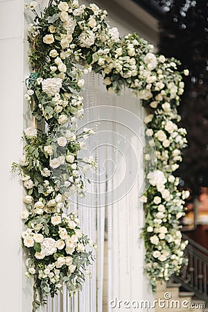 Arch decorated with flowers at the wedding caremony Stock Photo