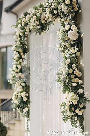 Arch decorated with flowers at the wedding caremony Stock Photo