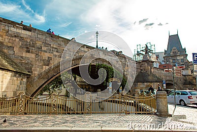 Arch of the old Charles Bridge in Prague above the devil river channel ertovka Editorial Stock Photo