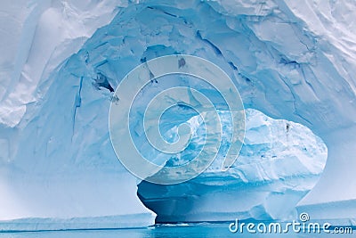 Arch Shaped Iceberg in Antarctic Waters Stock Photo