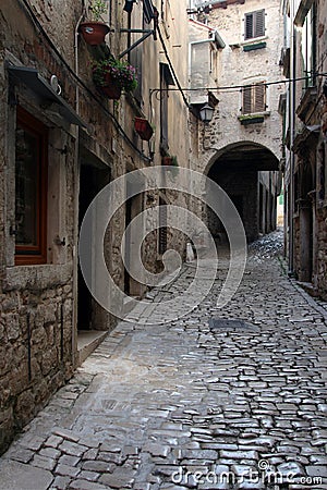 Arch on the stonepaved Garzotto street in Rovinj Stock Photo