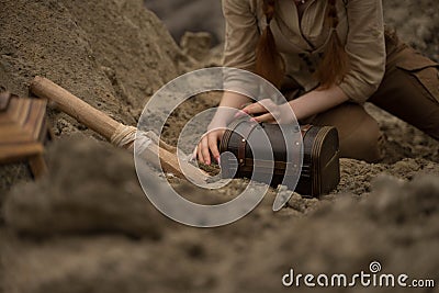 Archaeologist excavates and searches for treasure Stock Photo