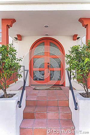 Arched double door with ornate glass panel at San Clemente, California Stock Photo