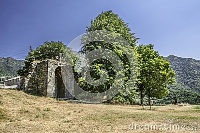 Arched entrance with a carved stone cross in the Haghpat Monastery Stock Photo