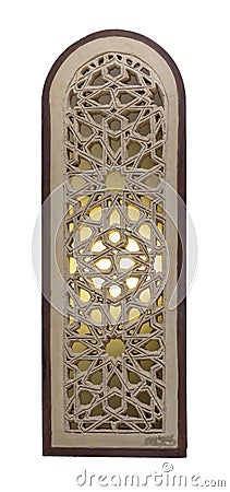 Arched stucco window decorated with illuminated stain glass with geometrical patterns, a Mamluk era tradition Stock Photo