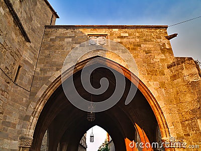Arched tunnel gate with lamps. Stock Photo