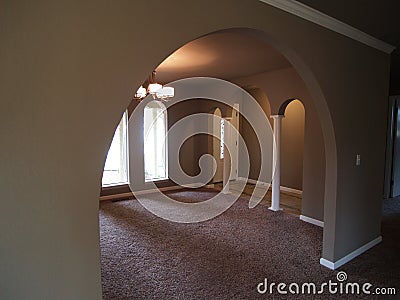 Arched Windows and front hall way of empty house Stock Photo