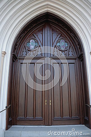 Arched wooden church door Stock Photo