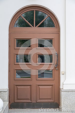 Arched wooden door with glass Stock Photo