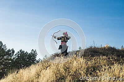 Archer follow the endless field. Stock Photo