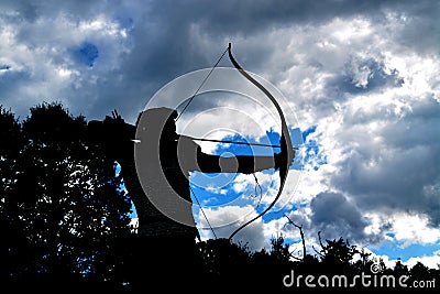 Archer of the side in silhouette with clouds Stock Photo