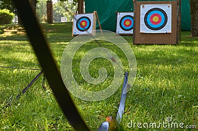 Archery concept with targets and bow Stock Photo