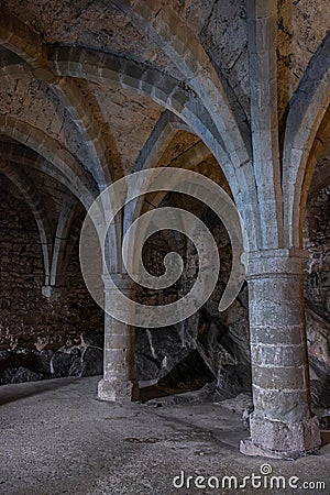 Arches and columns of the Chillon Castle dungeon Stock Photo