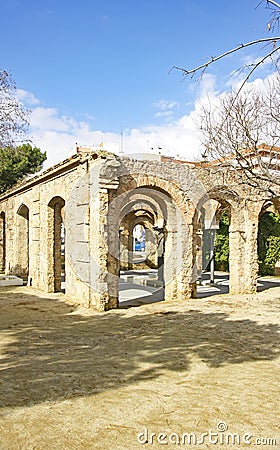 Arches and columns with fountain and pond in El Clot park, Barcelona Editorial Stock Photo