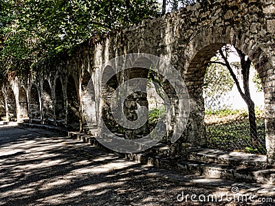 Arches in the Grounds of the Mon Repose Palace on the Greek Island of Corfu Editorial Stock Photo