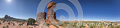 ARCHES NP - JULY 1, 2019: Balanced Rock panoramic view with tourists, Arches National Park Editorial Stock Photo