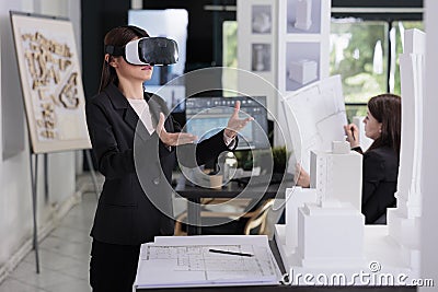 Architect in ar helmet working on architectural project Stock Photo