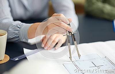 Architect with blueprint and drafting compass Stock Photo