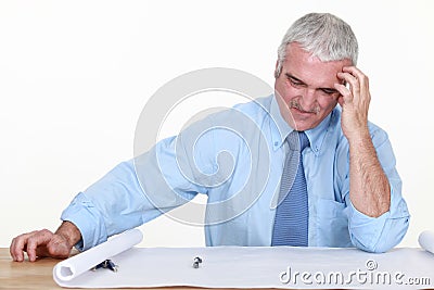 Architect dubious of his plans. Stock Photo