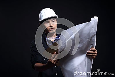 Architect Engineer in hard hat and safety equipment Stock Photo