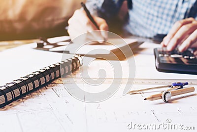 Architect engineer man calculate building area with equipment on Stock Photo