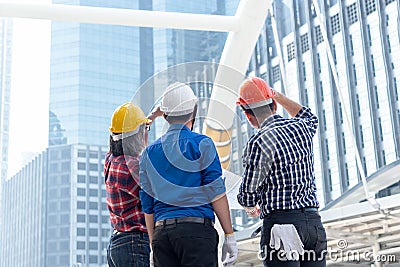 Architect engineer team planning blue print in construction city site. Workers security control Stock Photo