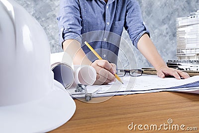 Architect or engineer working on blueprint, Construction and engineering concept. Stock Photo