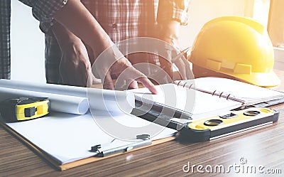 Architect engineer working concept and construction tools or safety equipment on table. Stock Photo