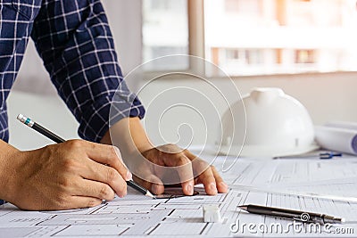 Architect hand sketching a construction project Stock Photo