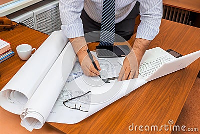 Architect man working with blueprints Stock Photo