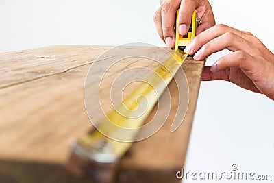 Architect measuring wood with tape Stock Photo