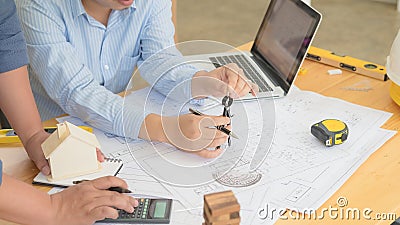 Architect or planner working on drawings for construction Stock Photo