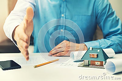 Architect real estate agent offering partnership to customer Stock Photo
