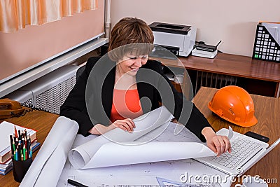 Architect woman working with blueprints Stock Photo