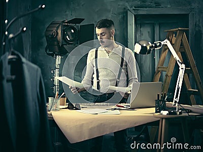 Architect working on drawing table in office Stock Photo