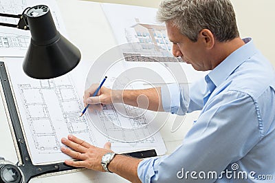 Architect Working At Drawing Table Stock Photo