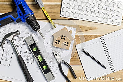 Architect workplace top view. Architectural project, blueprints, blueprint rolls on table. Construction background. Engineering to Stock Photo