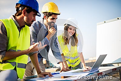 Architects, business manager and engineer meeting project at building site Stock Photo