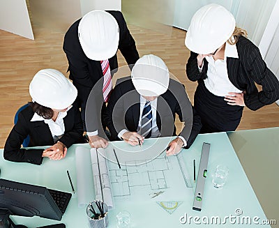 Architects discussing a blueprint Stock Photo