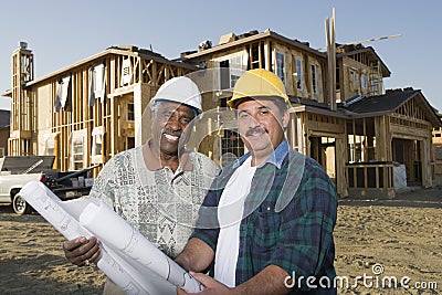 Architects In Front Of Incomplete House Stock Photo